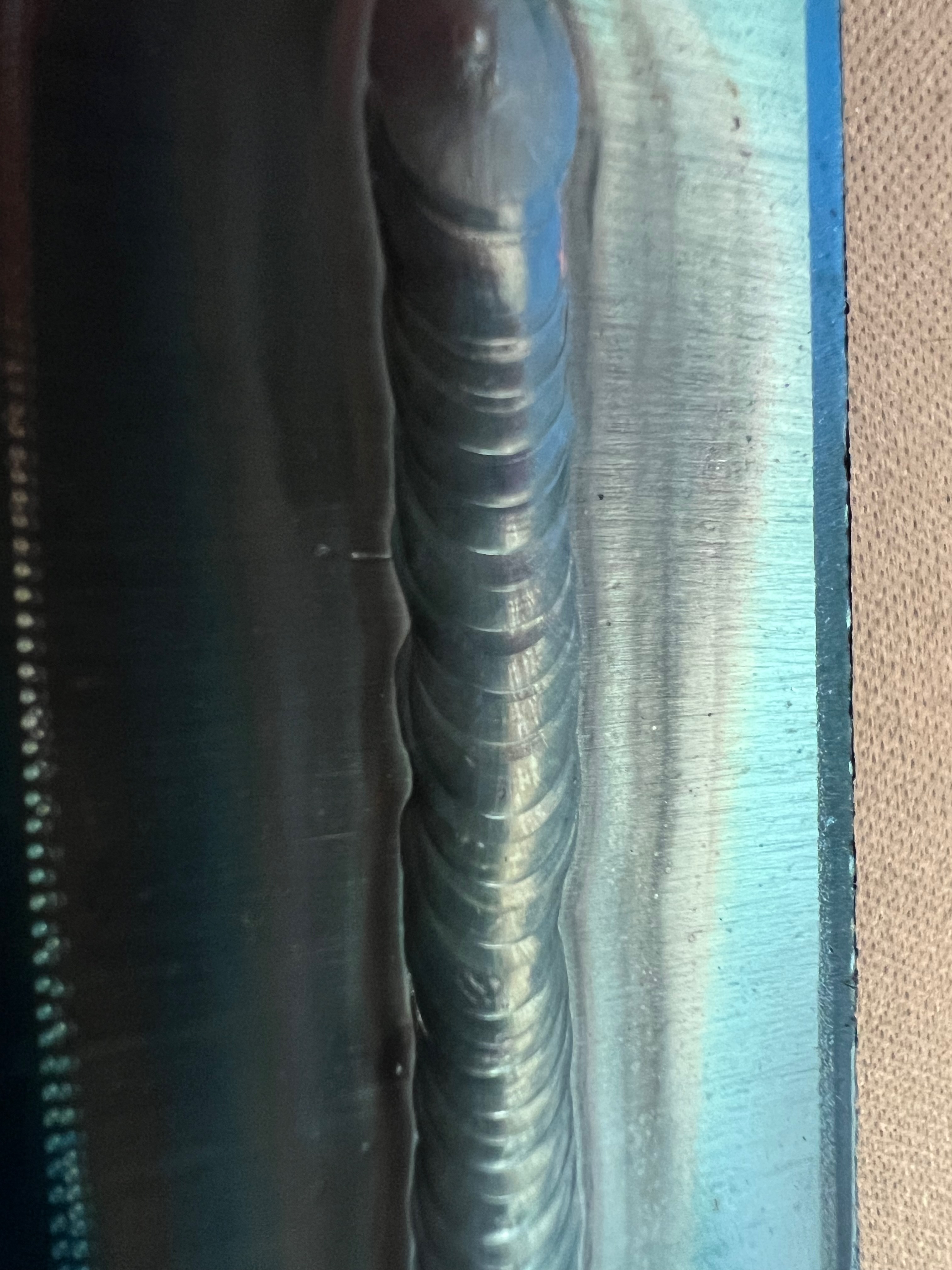 Clean TIG weld with consistent ripples and proper heat coloration